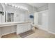 Well-lit bathroom featuring neutral tile flooring, an expansive vanity, and a shower-tub combination at 2821 Almaton Loop # 105, Kissimmee, FL 34747