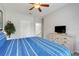 Comfortable bedroom featuring bright natural light with soft, cozy bedding and decor at 2821 Almaton Loop # 105, Kissimmee, FL 34747