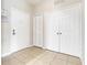 Welcoming foyer area with tile flooring, coat closet and storage space at 2821 Almaton Loop # 105, Kissimmee, FL 34747