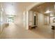 Inviting and carpeted hallway with elevator access and decorative bench seating at 2821 Almaton Loop # 105, Kissimmee, FL 34747