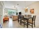 Open-concept living and dining area with tile floors and plenty of natural light at 2821 Almaton Loop # 105, Kissimmee, FL 34747