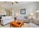 Cozy living room features tile floors, neutral paint, and ample seating at 2821 Almaton Loop # 105, Kissimmee, FL 34747