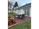 Outdoor brick patio featuring a dining set, perfect for enjoying meals and relaxing in the backyard at 2864 Trenton Ln, Deltona, FL 32738