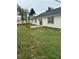 A home exterior featuring a lovely yard and garden area, perfect for outdoor enjoyment at 2864 Trenton Ln, Deltona, FL 32738