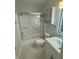 Bathroom with modern vanity, shower, and updated mirror at 2864 Trenton Ln, Deltona, FL 32738
