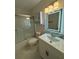 Bathroom with updated vanity, lighting, and glass shower at 2864 Trenton Ln, Deltona, FL 32738