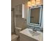Bathroom featuring a modern vanity, mirror, and updated fixtures at 2864 Trenton Ln, Deltona, FL 32738