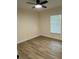 An empty bedroom features neutral walls, a ceiling fan, and natural lighting at 2864 Trenton Ln, Deltona, FL 32738