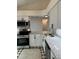 Updated kitchen with stainless steel appliances, granite countertops and white cabinets at 2864 Trenton Ln, Deltona, FL 32738
