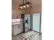 Kitchen with white cabinets, stainless steel refrigerator, and granite countertops at 2864 Trenton Ln, Deltona, FL 32738