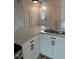 Bright kitchen with stainless steel appliances, granite countertops, and white cabinets at 2864 Trenton Ln, Deltona, FL 32738