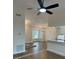The combined Living Room and Kitchen space features modern lighting and tiled floors at 2864 Trenton Ln, Deltona, FL 32738