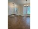A spacious living area showcases beautiful tiled floors, large windows, and modern lighting fixtures at 2864 Trenton Ln, Deltona, FL 32738
