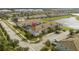 An aerial view of the property showing a beautiful community and nearby lake at 3085 Tom Sawyer Dr, Kissimmee, FL 34746