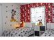 Charming bedroom with twin beds, themed decor, and a bright window view at 3085 Tom Sawyer Dr, Kissimmee, FL 34746