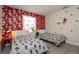 Charming bedroom featuring two twin beds, delightful Mickey Mouse themed decor, and a bright window at 3085 Tom Sawyer Dr, Kissimmee, FL 34746