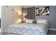 Comfortable bedroom featuring a queen bed, stylish decor and a calming color palette at 3085 Tom Sawyer Dr, Kissimmee, FL 34746