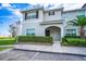 Charming two-story home featuring neat landscaping, tiled roof and covered entry way at 3085 Tom Sawyer Dr, Kissimmee, FL 34746