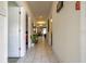 Inviting hallway with tiled floors leads to a bright and spacious living area at 3085 Tom Sawyer Dr, Kissimmee, FL 34746