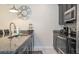 Kitchen featuring granite countertops, stainless steel appliances, and sleek cabinetry at 3085 Tom Sawyer Dr, Kissimmee, FL 34746
