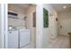 Laundry room with washer, dryer, and storage space at 3085 Tom Sawyer Dr, Kissimmee, FL 34746