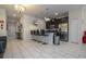 Open-concept living area with modern decor, tile floors and great natural light at 3085 Tom Sawyer Dr, Kissimmee, FL 34746