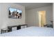 Brightly lit bedroom boasts a flat screen TV, king bed, and a convenient en suite bathroom at 3085 Tom Sawyer Dr, Kissimmee, FL 34746