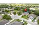 Beautiful aerial view of the neighborhood showcasing lush green lawns and mature trees at 3281 Saloman Ln, Clermont, FL 34711