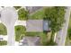 Overhead shot of a house with a well-kept yard and an outdoor screened-in patio area at 3281 Saloman Ln, Clermont, FL 34711