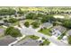 Bird's eye view of a community with manicured lawns, mature trees, and well-maintained homes at 3281 Saloman Ln, Clermont, FL 34711