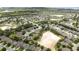 Wide aerial community shot showcasing the layout of the neighborhood and common areas at 3281 Saloman Ln, Clermont, FL 34711