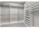 A well-organized walk-in closet with shelves and rods for maximum storage and organization at 3281 Saloman Ln, Clermont, FL 34711