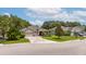 Charming exterior featuring a well-manicured lawn and an attached two-car garage at 3281 Saloman Ln, Clermont, FL 34711
