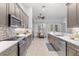 Kitchen area boasting stainless steel appliances, light countertops, and tiled backsplash at 3281 Saloman Ln, Clermont, FL 34711