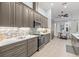 Kitchen and dining area with stainless steel appliances, light countertops, and tiled backsplash at 3281 Saloman Ln, Clermont, FL 34711