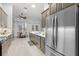 Kitchen features stainless steel appliances, light countertops, and wood look floors at 3281 Saloman Ln, Clermont, FL 34711