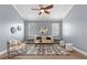 Cozy living room with a ceiling fan, neutral walls, area rug, and comfortable seating at 3281 Saloman Ln, Clermont, FL 34711