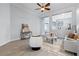 Bright and airy living room featuring tile floors, neutral walls, and open layout to the dining area at 3281 Saloman Ln, Clermont, FL 34711