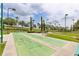 Outdoor shuffleboard courts with lush greenery and landscaping on a sunny day at 3281 Saloman Ln, Clermont, FL 34711