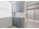 Custom cabinets offer ample storage space next to walk-in closet with great natural light at 3281 Saloman Ln, Clermont, FL 34711