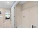 Hallway with a laundry area, neutral carpet, and views into a bedroom with a ceiling fan at 3342 Canyon Bay Pt, Sanford, FL 32773