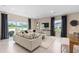 Living room area features a plush couch with a view of the outside at 3342 Canyon Bay Pt, Sanford, FL 32773