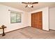 Neutral bedroom featuring a window, carpeted floors, a ceiling fan, and a closet at 353 Wekiva Cove Rd, Longwood, FL 32779
