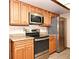 Well-appointed kitchen features stainless steel appliances, granite countertops, and ample cabinet space for storage at 353 Wekiva Cove Rd, Longwood, FL 32779
