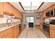 Modern kitchen features granite countertops, stainless steel appliances, ample cabinetry, and tiled floors at 353 Wekiva Cove Rd, Longwood, FL 32779