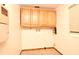 Practical laundry room area with upper cabinets and convenient utility connections at 353 Wekiva Cove Rd, Longwood, FL 32779
