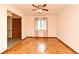Bright living room featuring hardwood floors, a ceiling fan, and natural light from the window at 353 Wekiva Cove Rd, Longwood, FL 32779