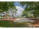 Lakefront community playground with slides, climbing equipment, and swings at 353 Wekiva Cove Rd, Longwood, FL 32779