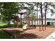A lakeside playground features slides and climbing equipment in a natural setting at 353 Wekiva Cove Rd, Longwood, FL 32779