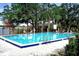 Community pool features ample lounge seating for relaxation, offering a refreshing escape at 353 Wekiva Cove Rd, Longwood, FL 32779